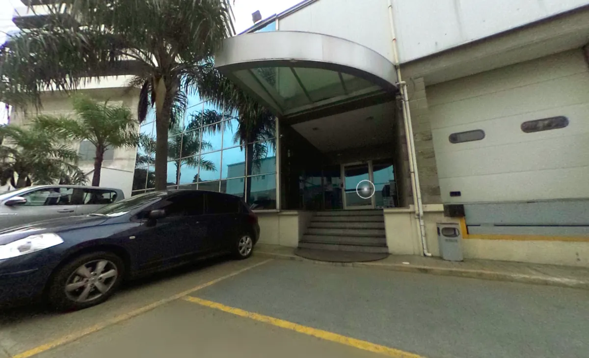 Datacenter exterior entrance: glass canopy over the main door and private parking