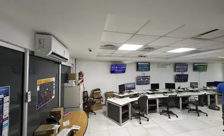 Datacenter monitoring room with metric dashboards