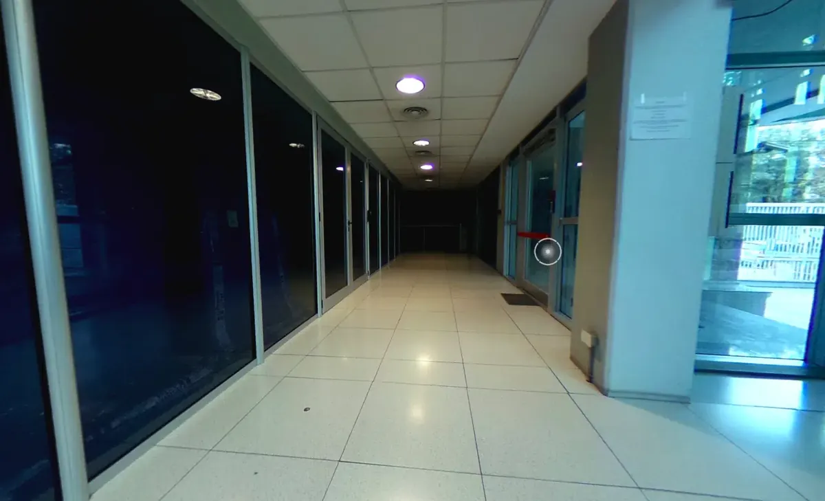 Main hallway of the building, with glass-walled technical offices on both sides